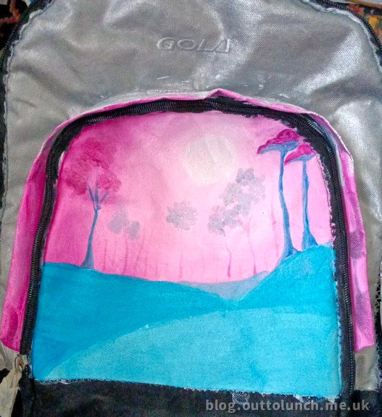 painting the scenery on the backpack