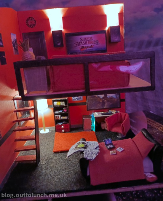 side view showing both floors, night time view with lights on