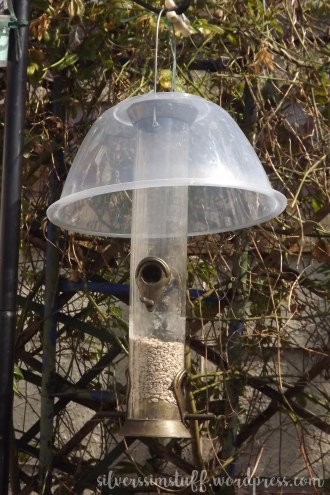 home made rainguard for bird feeder